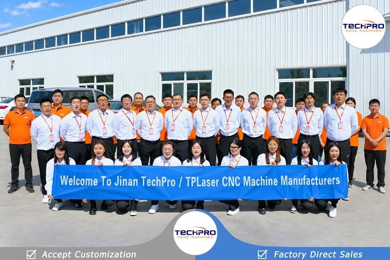 TechPro employees holding a company banner outside our CNC machine factory